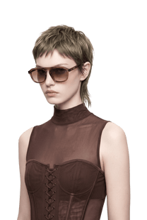 Dima Cameo crystal brown sunglasses elevate feminine charm with elegant lines.